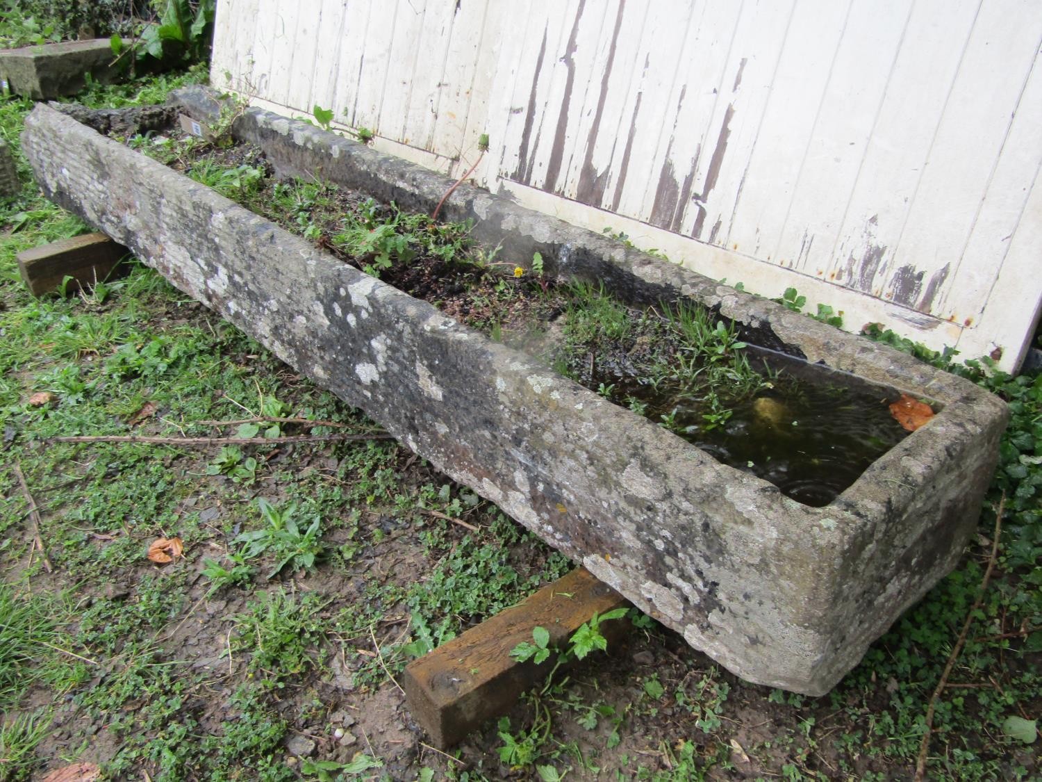 A long and narrow rectangular weathered natural carved stone trough with broken end 25 cm high x 222 - Image 2 of 4