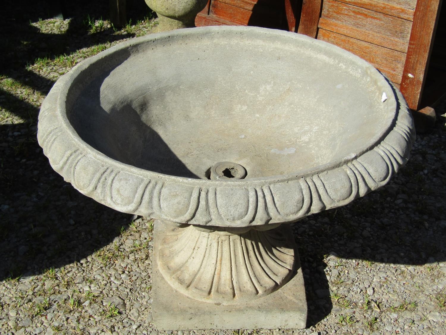 A pair of cast composition stone garden urns, the squat circular lobbed bowls with egg and dart - Image 2 of 2