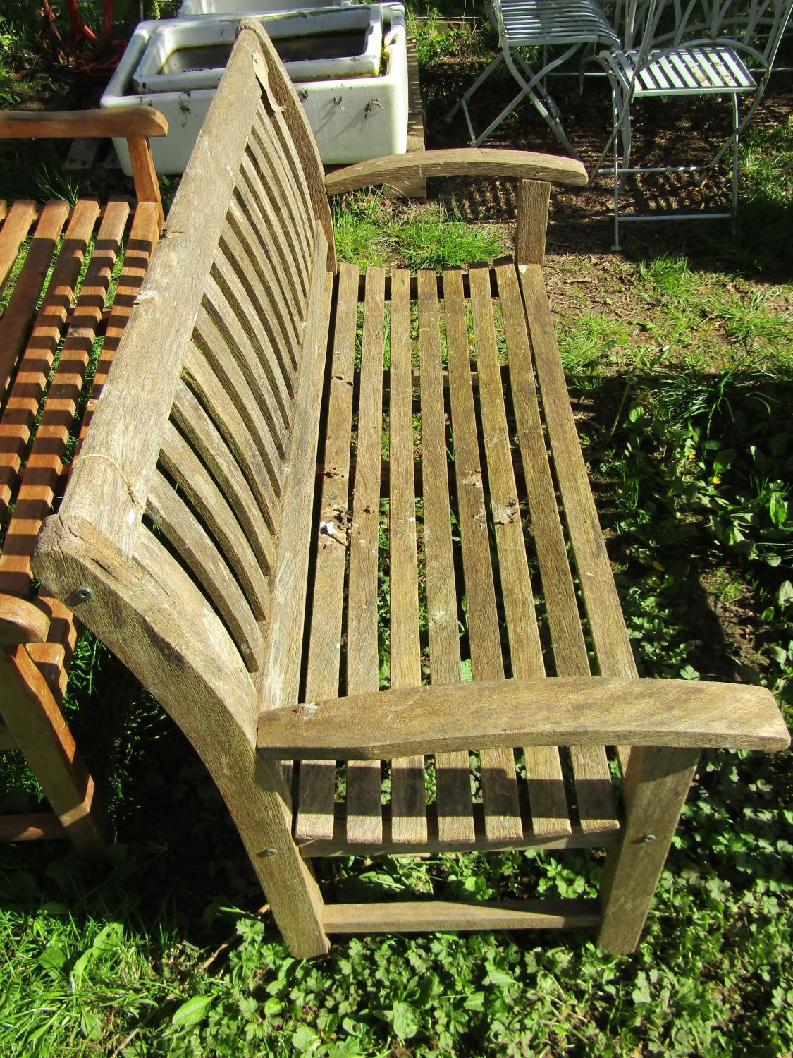 A weathered ‘Canterbury Collection’ teak garden bench with curved slatted seat, back and arms (AF) - Image 2 of 3