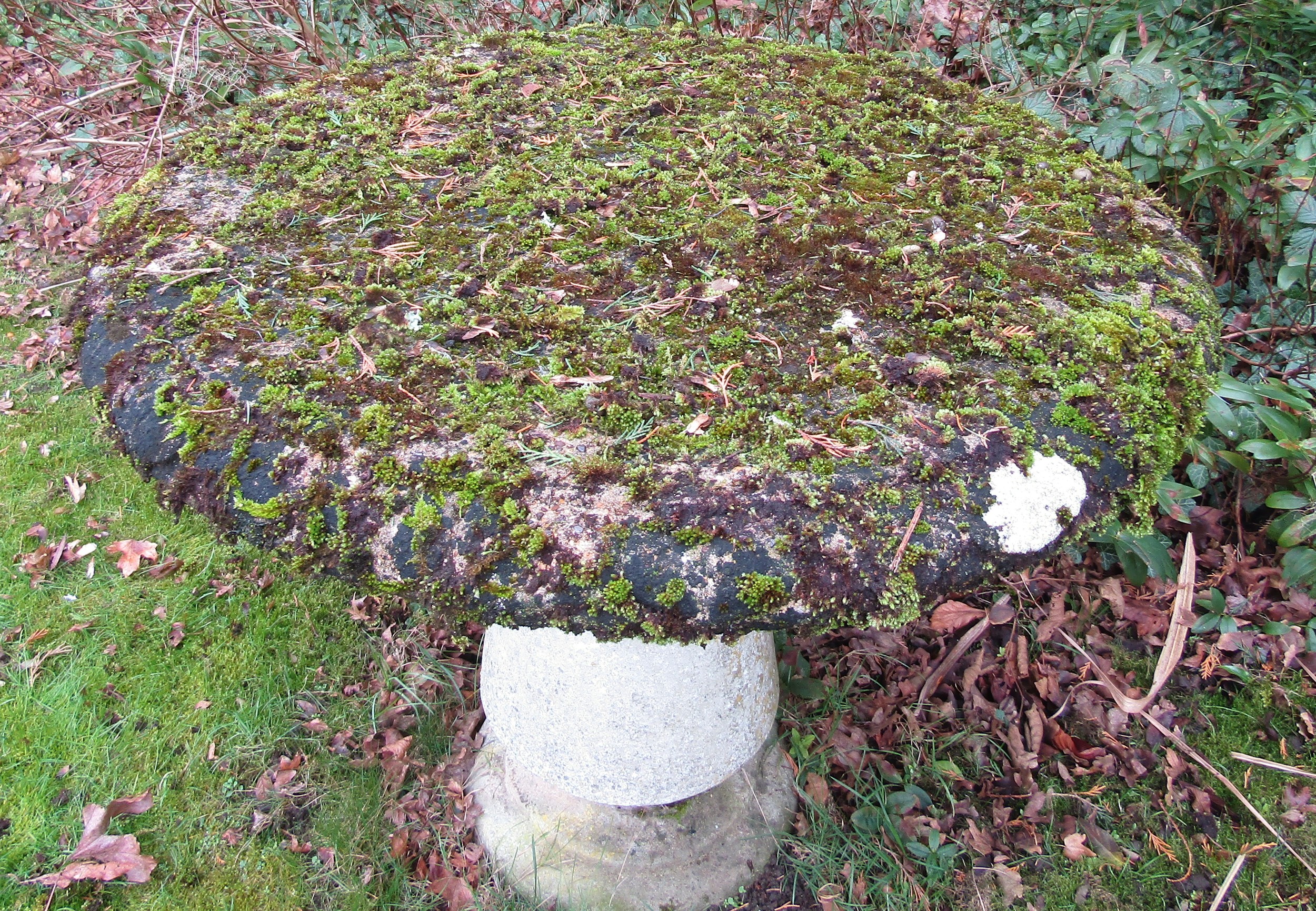 A good quality weathered reconstituted garden table, the circular top raised on a turned and - Image 3 of 3