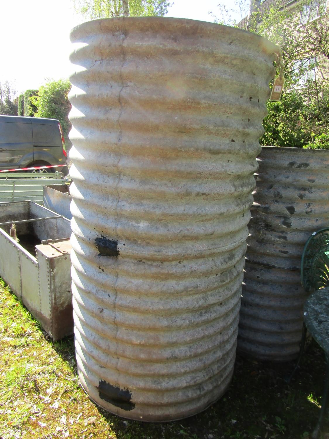 A large corrugated cylindrical tank, 165cm high, 87cm diameter