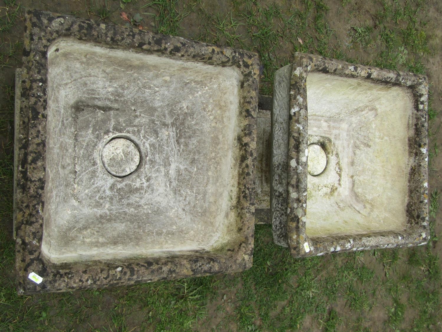 A pair of weathered cast composition stone garden urns of squat square cut and tapered form with - Image 2 of 4