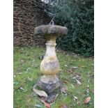 A reconstituted weathered sun dial on baluster support, 65 cm high