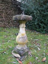 A reconstituted weathered sun dial on baluster support, 65 cm high