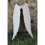 A decorative painted and weathered hanging garden ornaments in the form of a pair of angel wings, 64