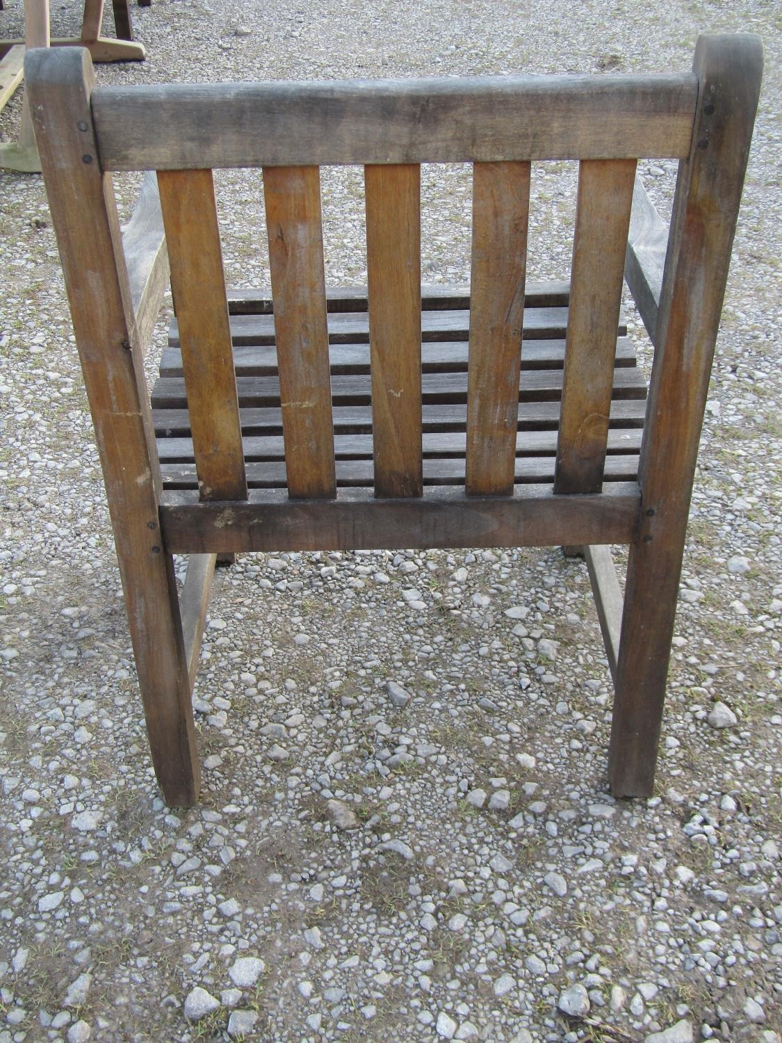 A contemporary Cotswold Collection weathered teak garden table with oval slatted top raised on - Image 3 of 6