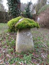 A limestone staddle stone and cap, moss encrusted, 75 cm in height approximate