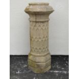 A weathered Doulton buff coloured tall gothic design chimney pot of cylindrical form with