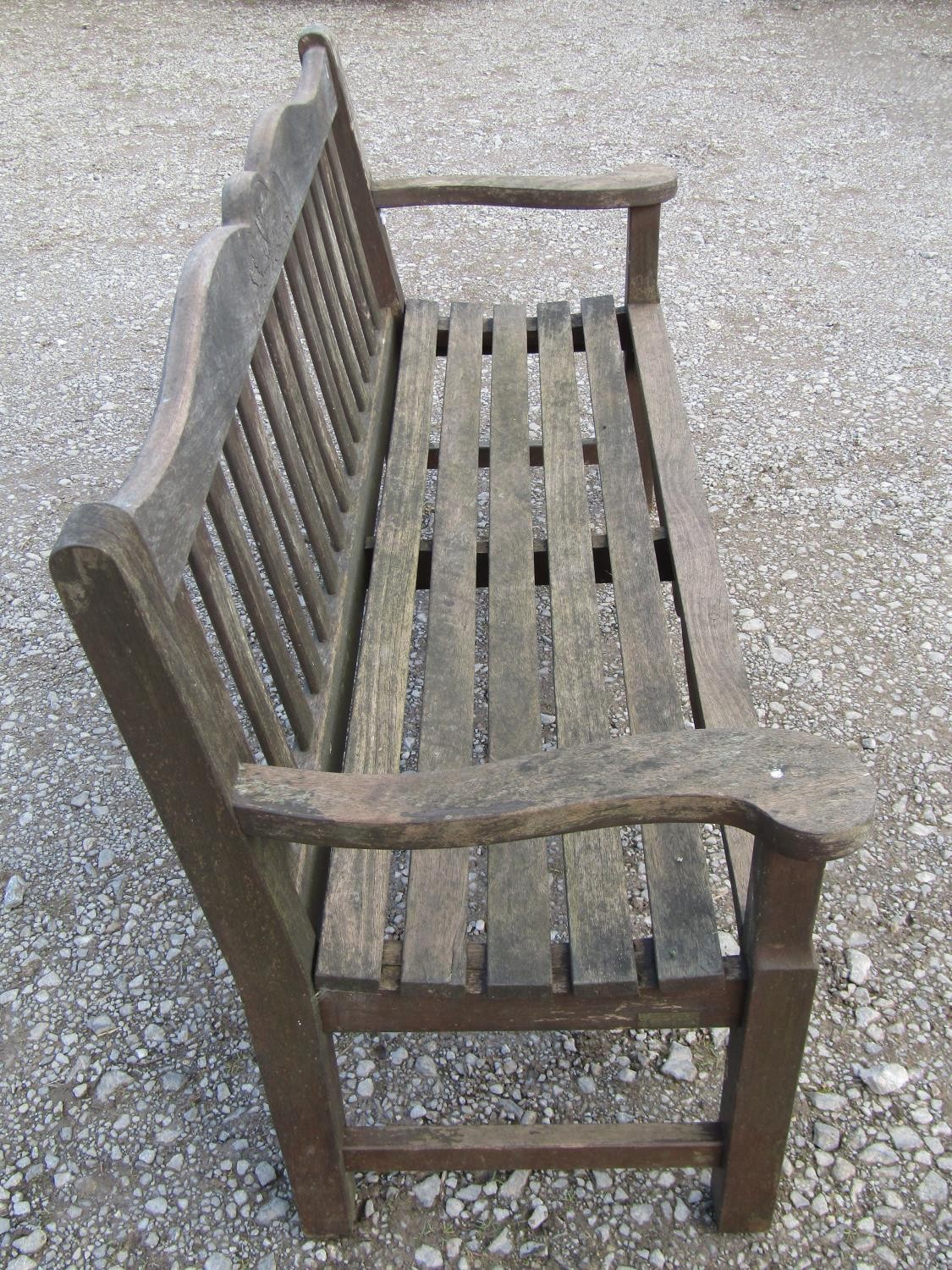 A Bridgman & Co Ltd stained and weathered teak three seat garden bench 161 cm wide and a pair of - Image 7 of 11