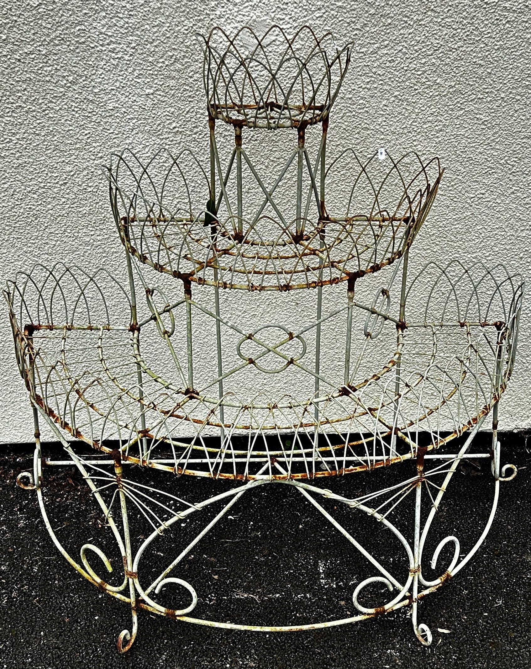 A weathered Victorian style wire work freestanding three tier conservatory/garden planter with