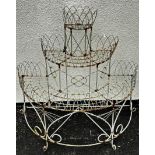 A weathered Victorian style wire work freestanding three tier conservatory/garden planter with