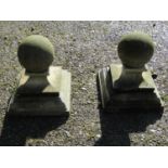 A pair of cast composition stone three sectional pier caps with ball finials, approx 20 cm diameter,