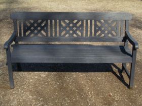 A Rayburn painted teak three seat garden bench with slatted seat and lattice panelled back (af)