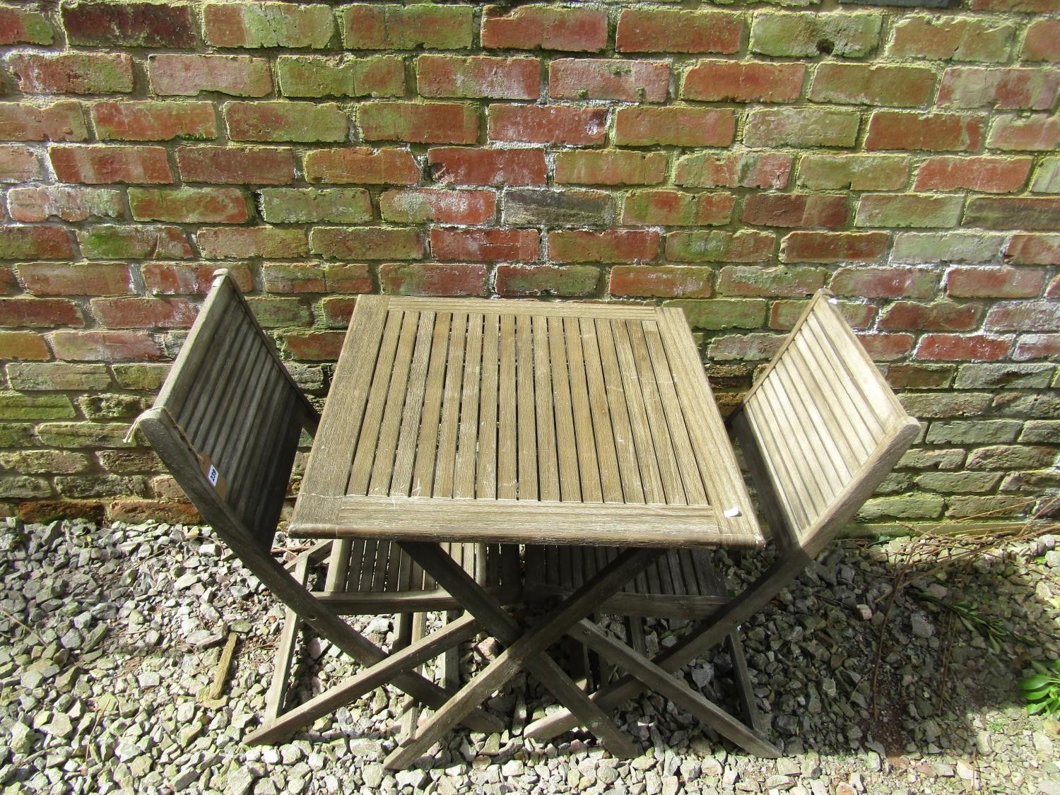 A contemporary wooden three piece folding terrace set with square slatted top table, and a pair of - Image 2 of 3