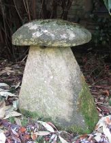 A large limestone staddle stone and cap, 80 cm in height