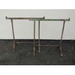 A pair of old iron work trestles with swept supports 75 cm (full height)m x 78 cm (full width)