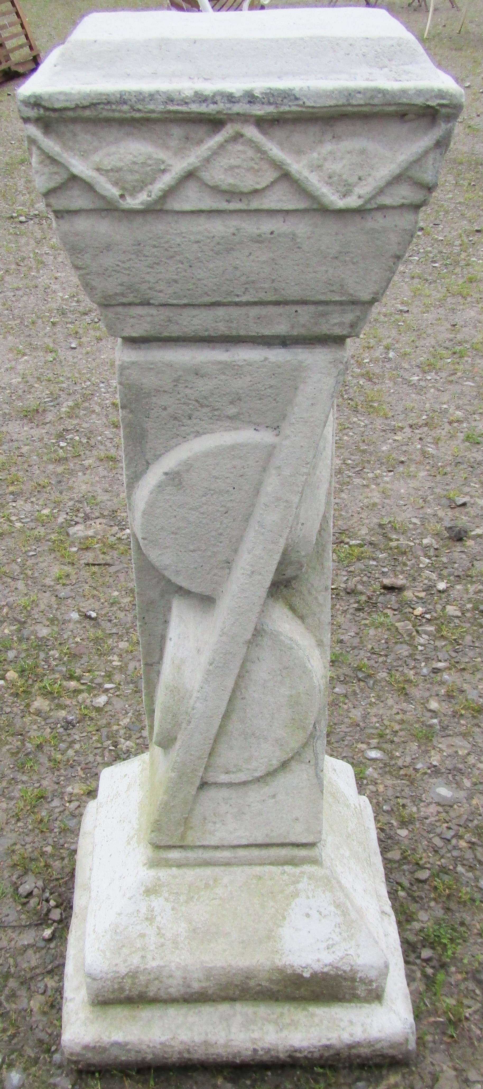 An Art Deco style cast composition stone pedestal of square tapered and stepped form with