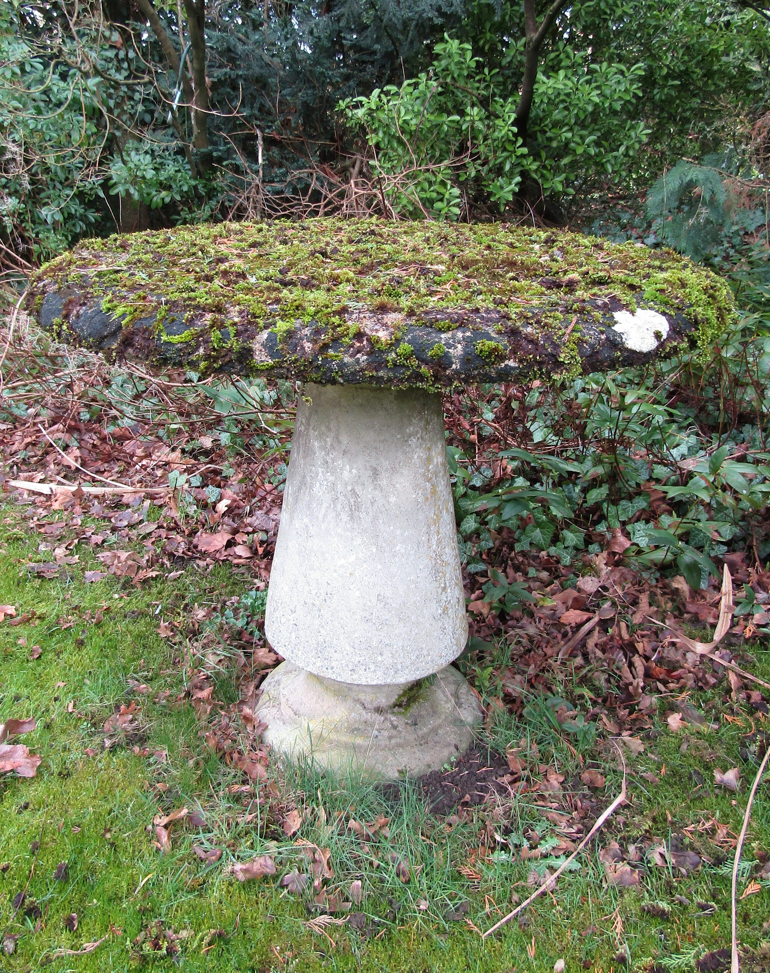 A good quality weathered reconstituted garden table, the circular top raised on a turned and - Image 2 of 3