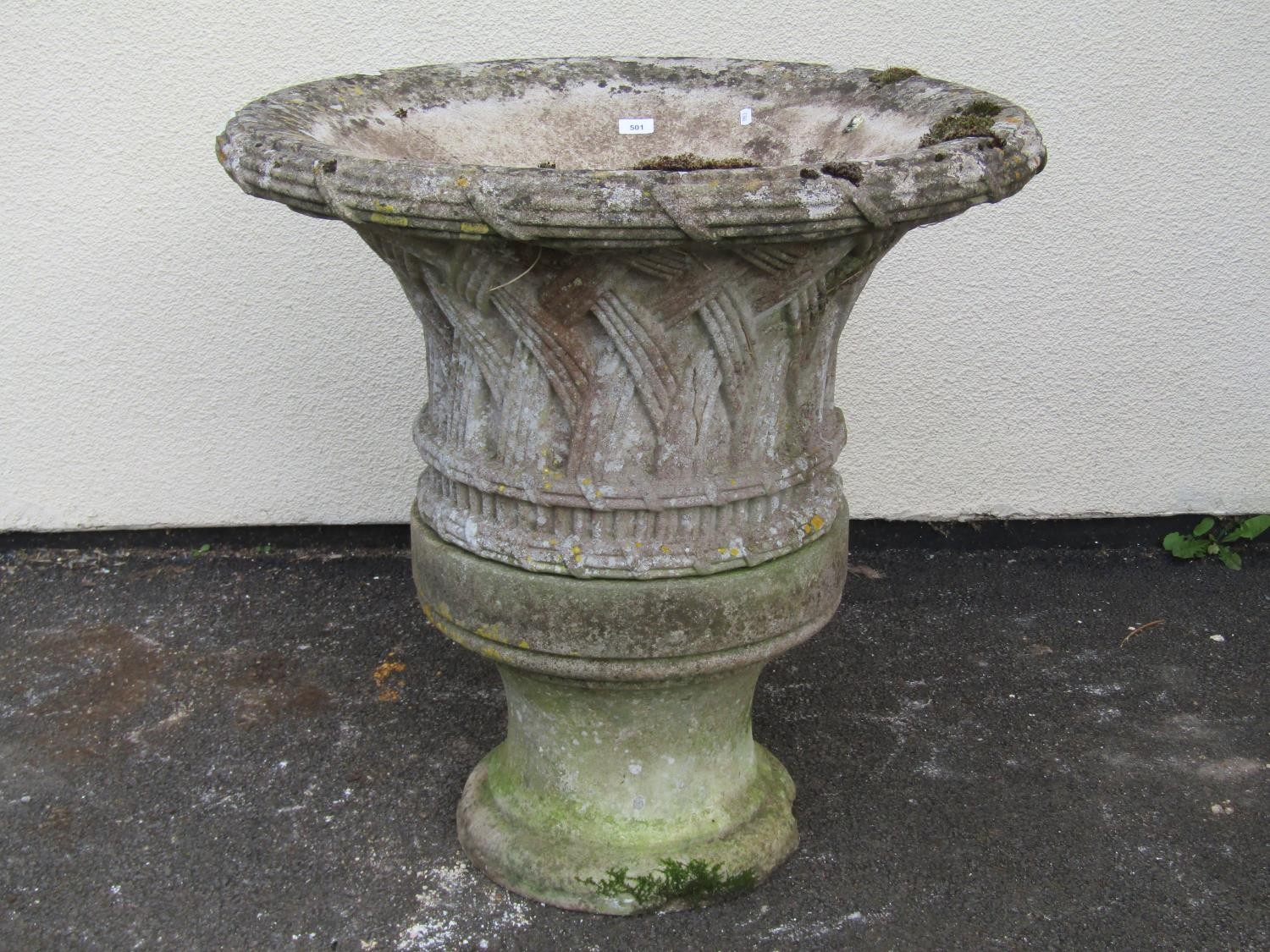 A large and impressive 19th century weathered carved natural stone planter / urn of flared form with