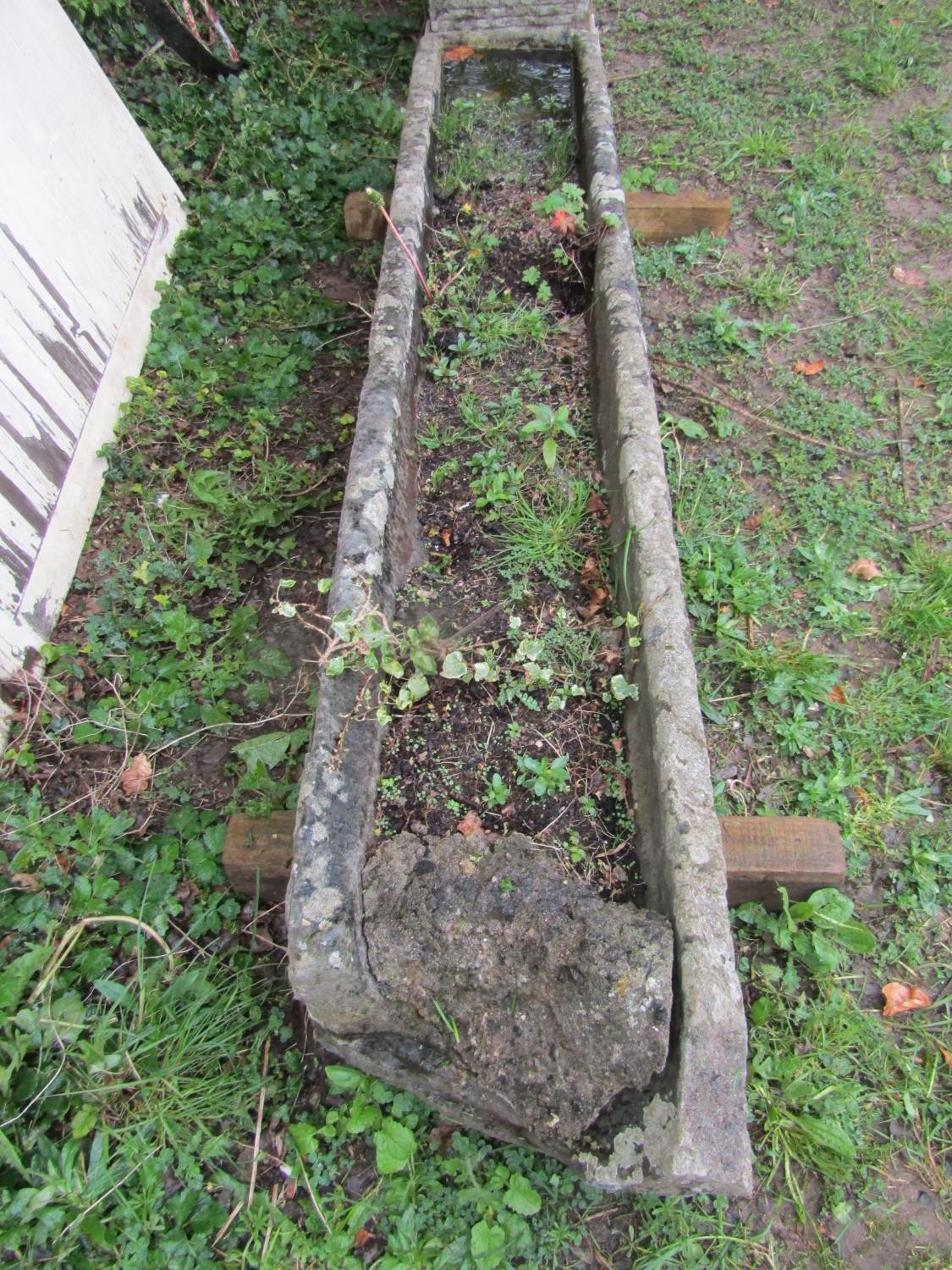 A long and narrow rectangular weathered natural carved stone trough with broken end 25 cm high x 222 - Image 3 of 4