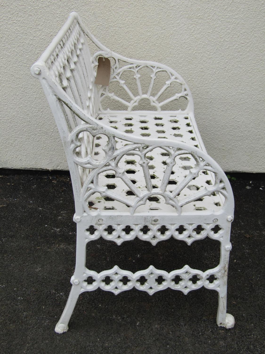 A small cream painted cast alloy two seat garden bench with pierced gothic tracery detail, 87 cm, - Image 2 of 4