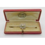 Early 20th century 15ct bi-colour bar brooch set with a pearl and rose-cut diamond cluster, 6.4cm