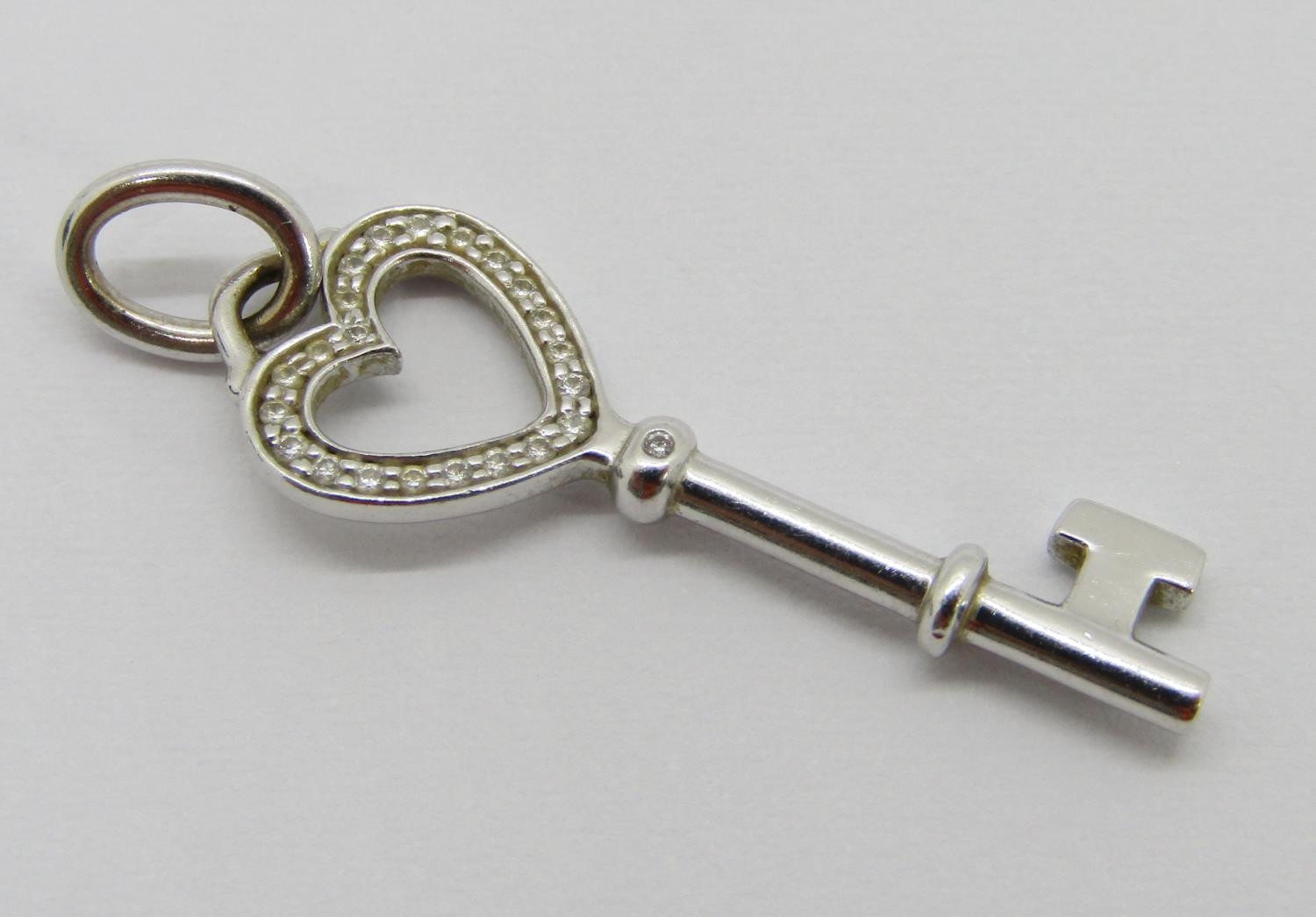 Tiffany & Co. 18ct white gold diamond set key pendant, 3.1cm L approx, 1.8g