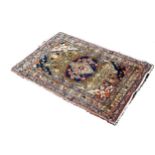 Five Old Middle Eastern small carpets, including a man smoking a hookah, a floral wall design, two