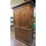 A 19th century linen press the lower section enclosed by two long and two short drawers, the upper