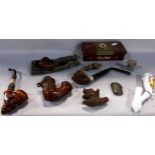 A collection of antique and vintage pipes, with carved wooden bowls , including a Ben Wade pipe, a
