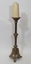 A tall 19th century continental brass pricket candlestick, with foliate moulded cradle and