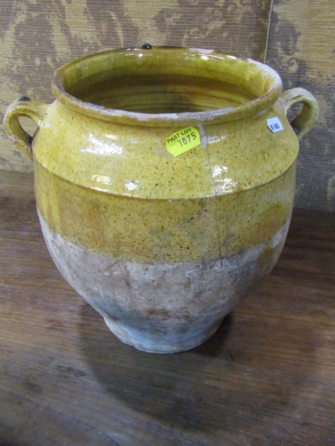 Three rustic terracotta pots with loop handles, partially glazed and a further terracotta ewer - Image 3 of 4