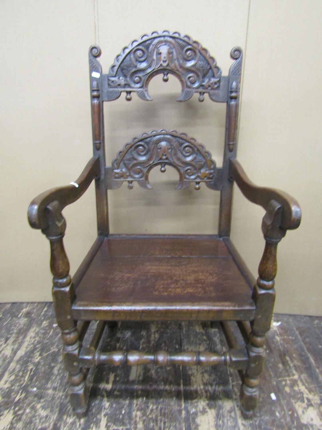 An antique oak South Yorkshire elbow chair of traditional form with carved and arched ladder back, - Image 2 of 4