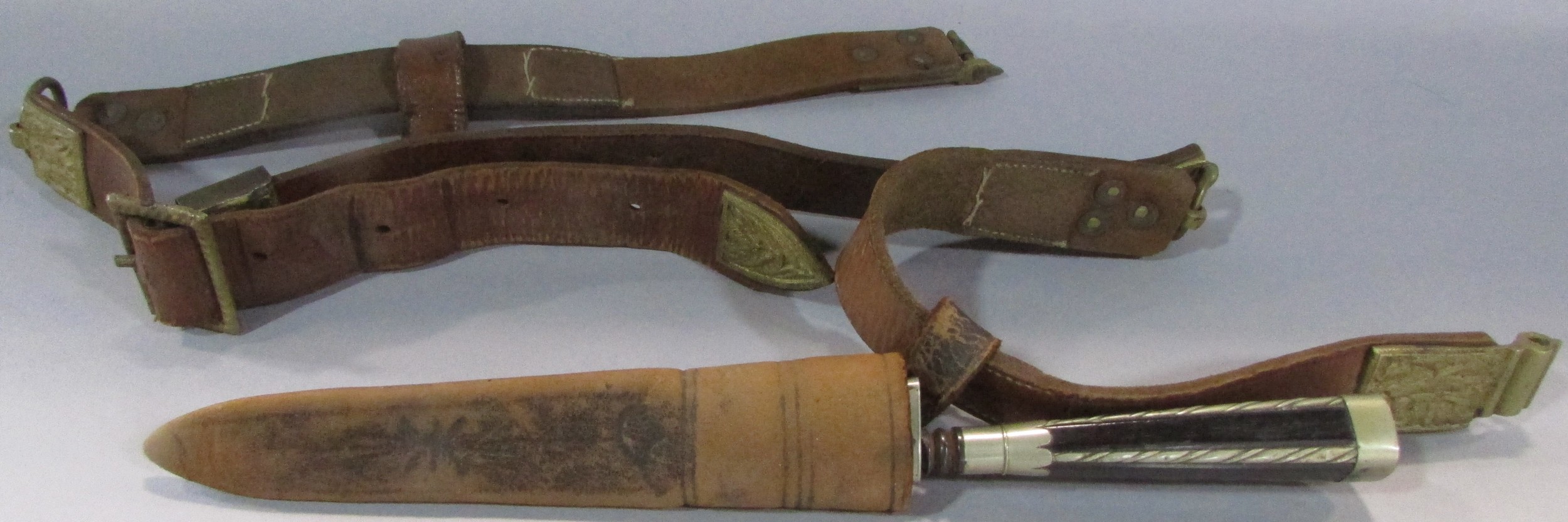 A Leather hunting belt, in three sections with gilded metal links each decorated with hunting scenes