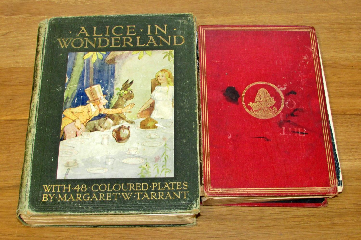 Two editions of Lewis Carroll's Alice's Adventures in Wonderland - the first (rare) 1881,