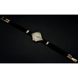 Rolex: A lady’s vintage wristwatch, with hexagonal case (lacking lens) on woven strap with 9ct