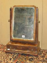 A Georgian walnut toilet mirror, the box base fitted with three drawers