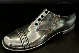 A silver pin cushion in the form of a brogue shoe, with wooden sole, Chester 1910, makers mark