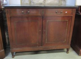 A 19th century mahogany side cupboard enclosed by two drawers and a single door, set beneath a