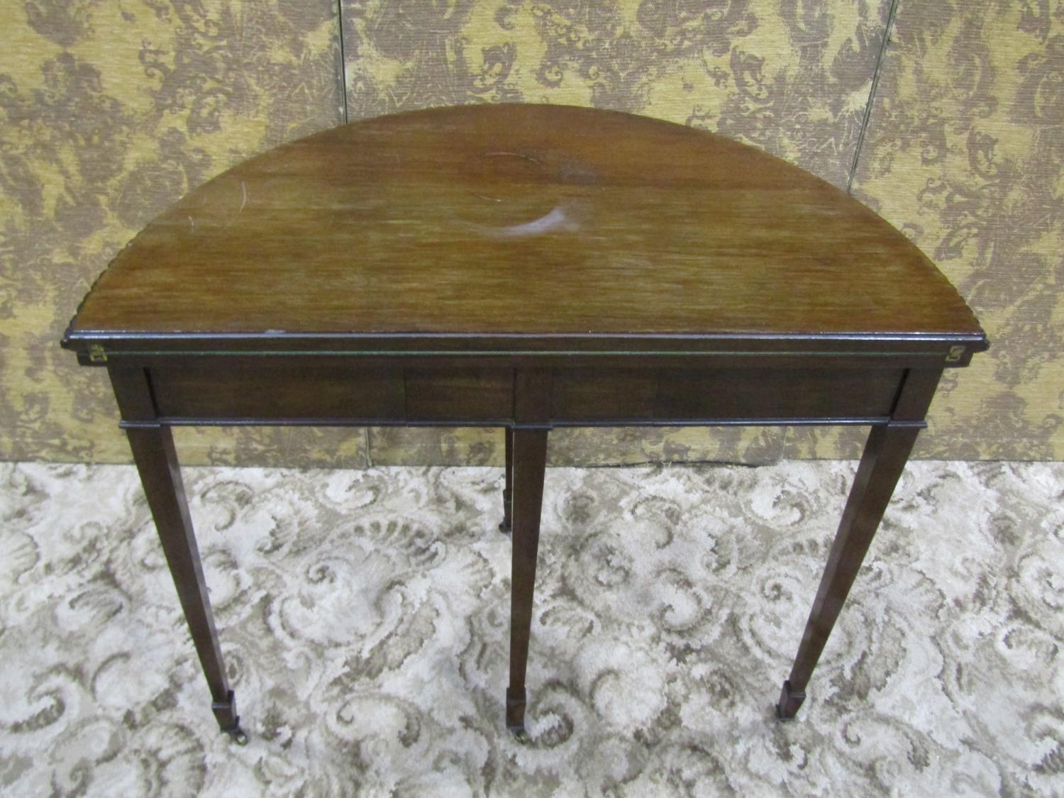 An Edwardian mahogany demi-lune fold over top card table in the Georgian style raised on square - Image 5 of 5