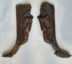 A large pair of early 19th century carved wood furniture / frame mounts, in the form of detailed