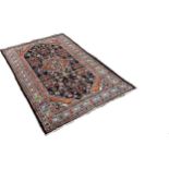 North West Persian Malayer Rug, with a pink diamond centre decorated with flowers surrounded by a