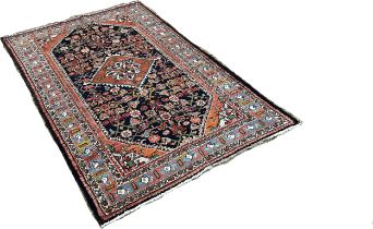 North West Persian Malayer Rug, with a pink diamond centre decorated with flowers surrounded by a