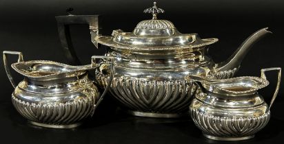 An Edwardian three piece silver tea service in the Georgian style, Birmingham 1908, maker William