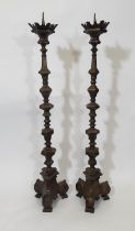 A tall and impressive pair of 19th century continental brass alter pricket candlesticks, each 88cm