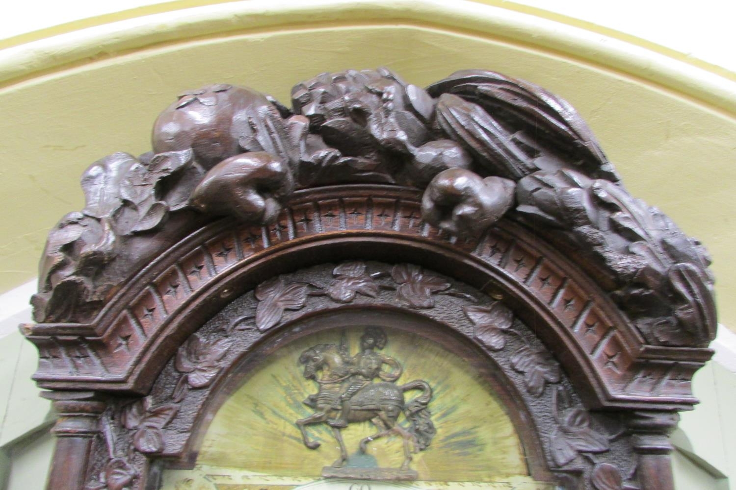 A 19th century oak longcase clock with heavy estate carving, the trunk detailing a knight fighting - Image 6 of 17