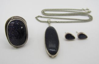 Group of silver jewellery set with blue goldstone comprising a dress ring and pendant both by 'OSW',