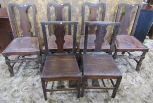 A set of four antique dining chairs with vase shaped splats and drop in seats, raised on turned