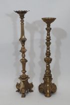 A heavy antique ecclesiastical brass pricket candlestick in the old English style, with tapering