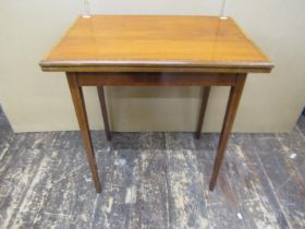 An inlaid Edwardian mahogany foldover top card table on square tapered legs, with satin wood